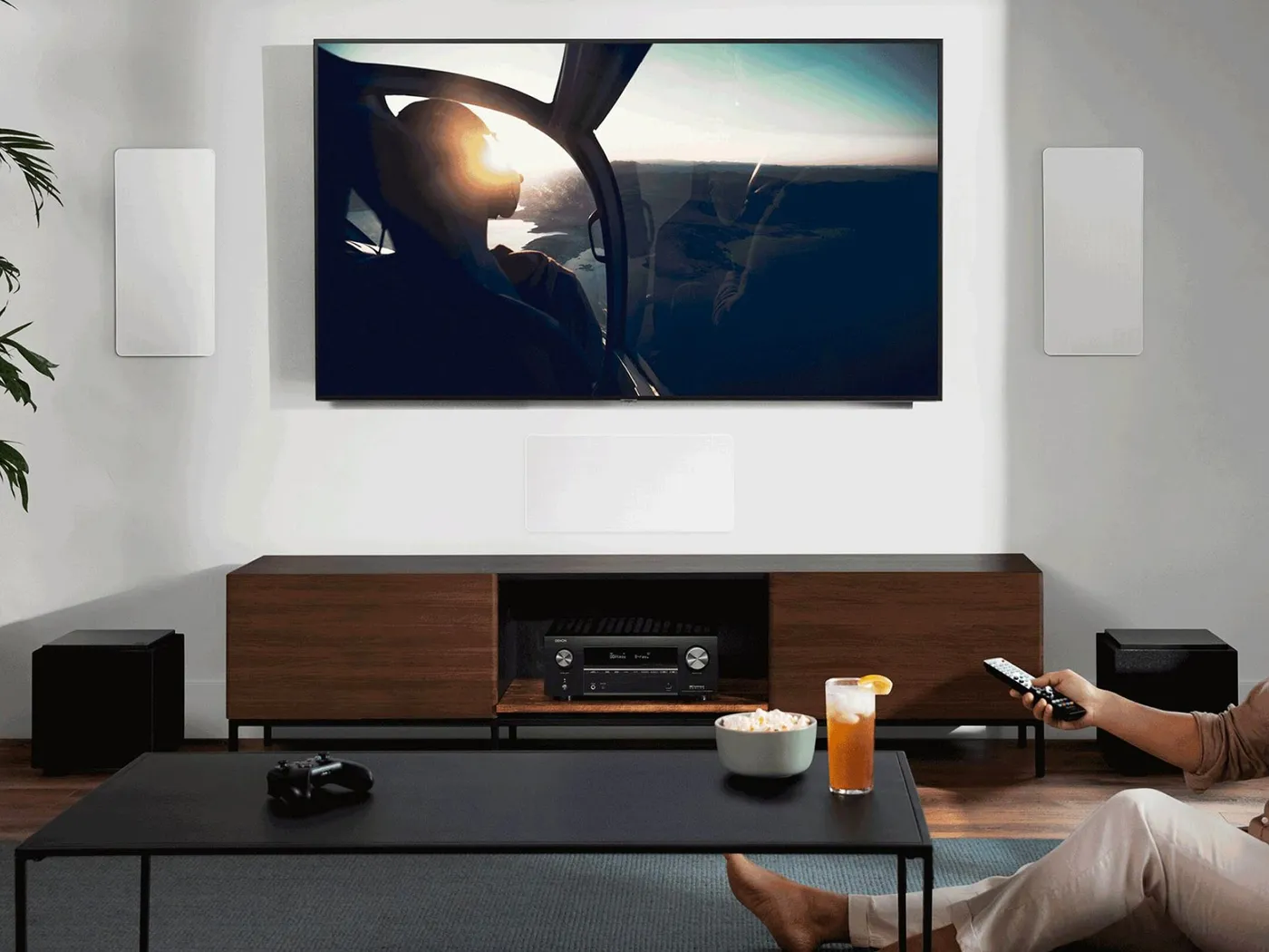 Denon AV receiver in a modern home cinema living room